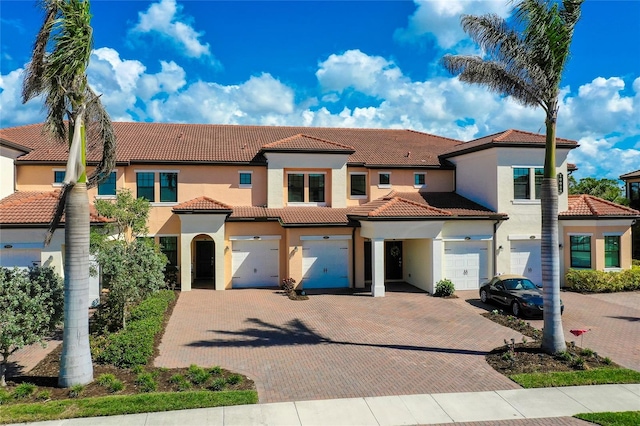 mediterranean / spanish house featuring a garage