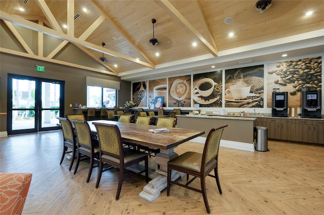 dining area featuring high vaulted ceiling, light parquet floors, wood ceiling, beam ceiling, and french doors