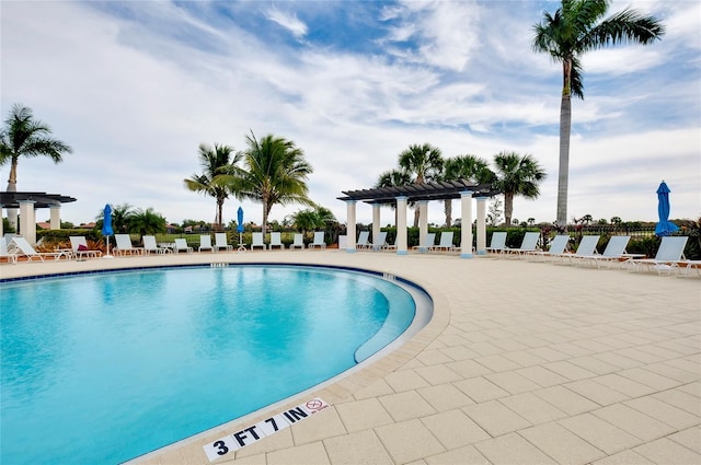 view of pool featuring a pergola and a patio