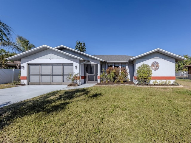 ranch-style house featuring a garage and a front lawn