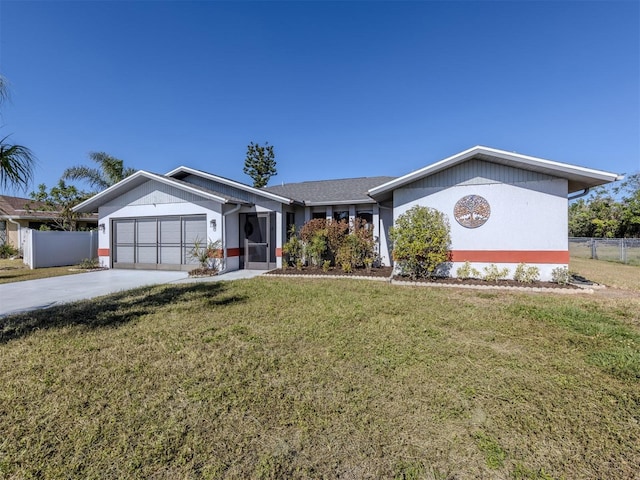 ranch-style home with a garage and a front lawn