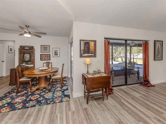 dining space with ceiling fan and light hardwood / wood-style floors