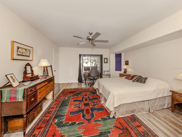 bedroom with ceiling fan and light hardwood / wood-style floors