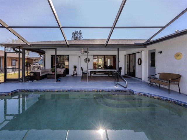 view of swimming pool with a patio, outdoor lounge area, and a lanai