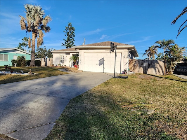 single story home with a garage and a front lawn