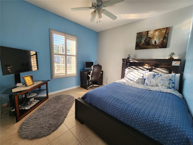 tiled bedroom with ceiling fan