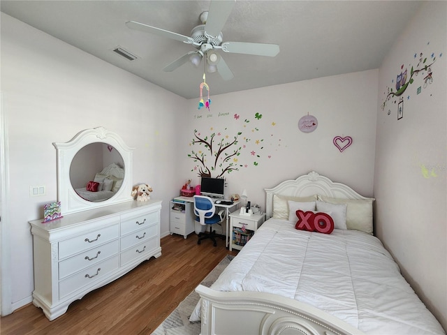 bedroom featuring dark wood-type flooring and ceiling fan