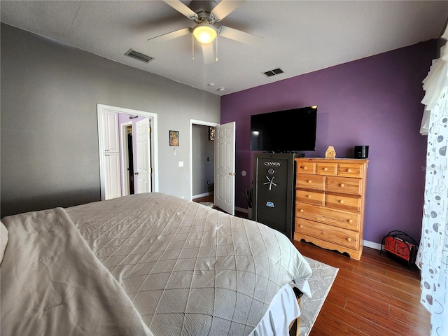 bedroom featuring ceiling fan and dark hardwood / wood-style flooring