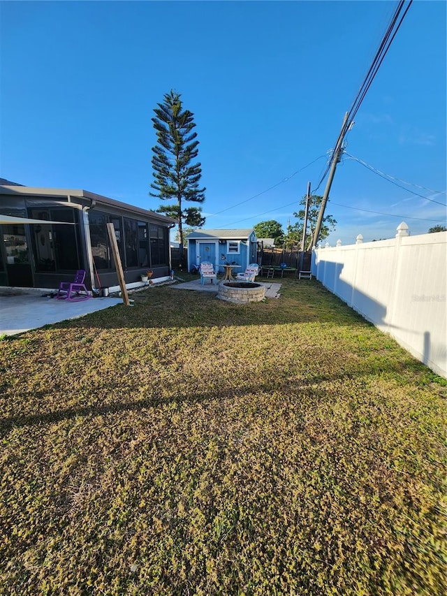 view of yard with a patio area and a sunroom