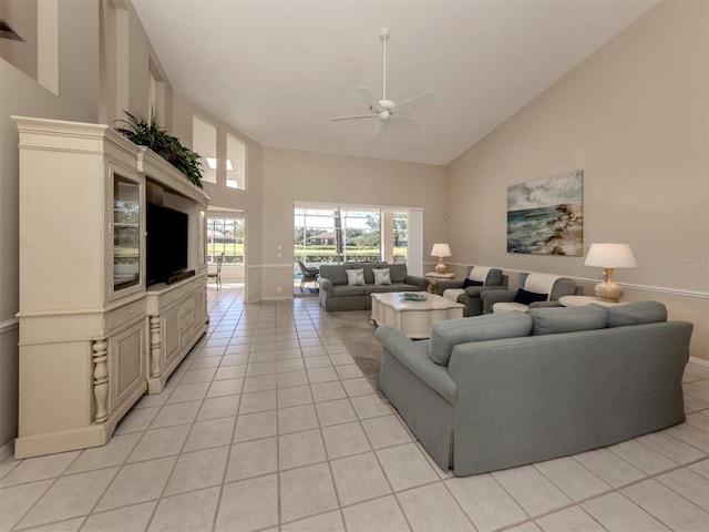 living room featuring light tile patterned floors, high vaulted ceiling, and ceiling fan