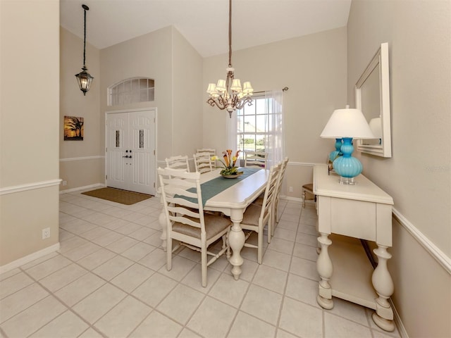 tiled dining area with a notable chandelier