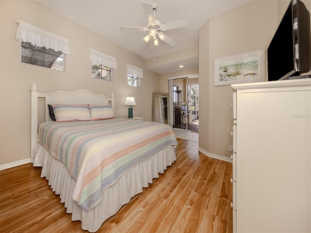 bedroom with ceiling fan and light hardwood / wood-style flooring