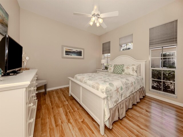 bedroom featuring ceiling fan and light hardwood / wood-style flooring