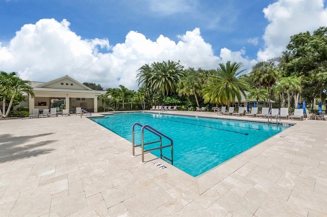 view of swimming pool featuring a patio area