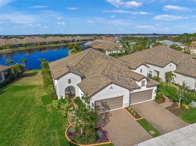 birds eye view of property with a water view