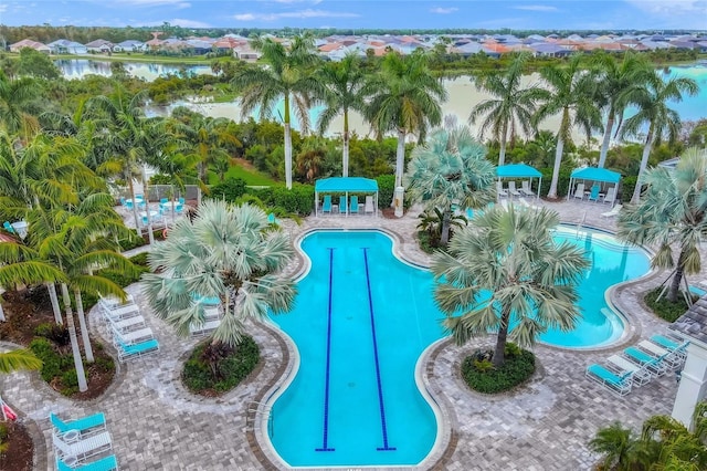 view of pool featuring a water view