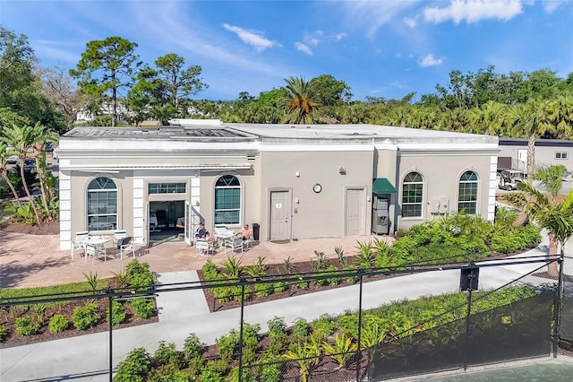 rear view of property featuring a patio