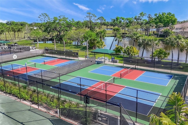 view of sport court featuring a water view