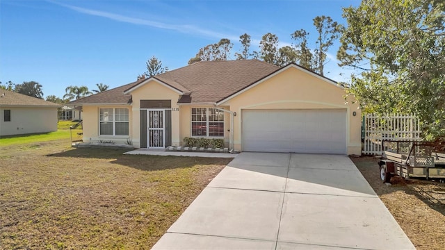 ranch-style house featuring a garage and a front yard