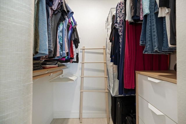 walk in closet featuring light hardwood / wood-style floors