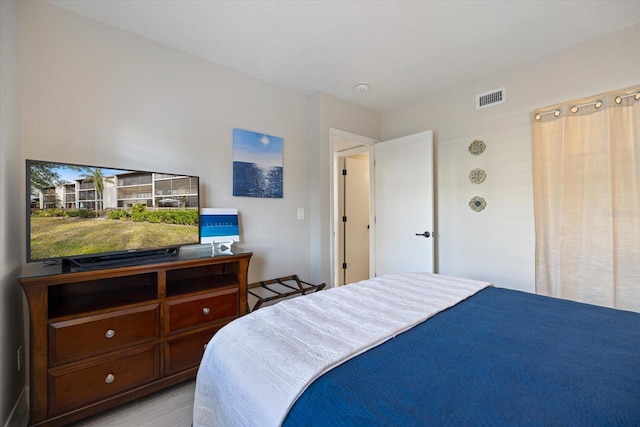 bedroom featuring light hardwood / wood-style floors