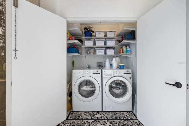 washroom with washer and dryer