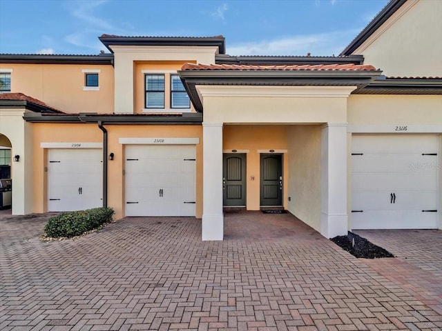 view of front of property with a garage