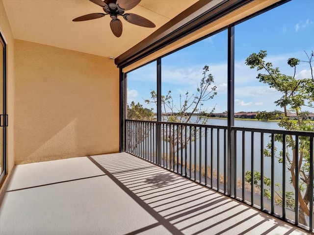 unfurnished sunroom with a water view