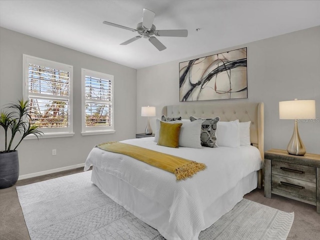 bedroom with ceiling fan and carpet