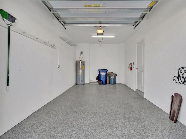 garage with water heater and a garage door opener