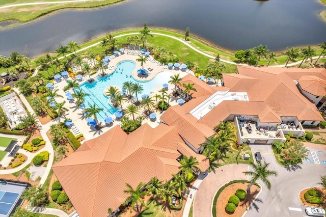 birds eye view of property with a water view