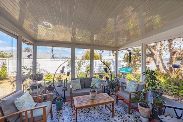 sunroom featuring wooden ceiling