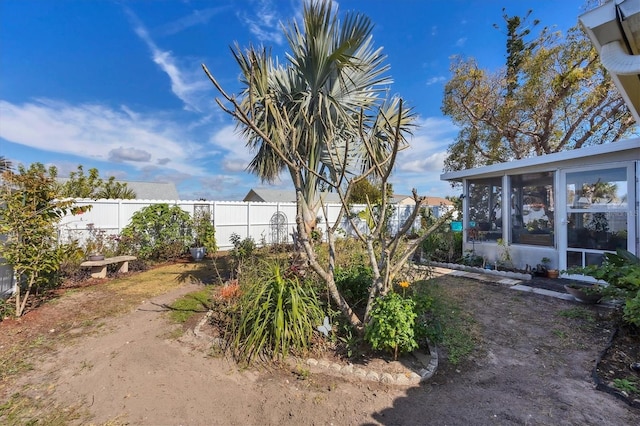 view of yard with a sunroom