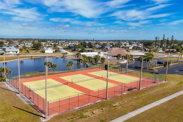 view of sport court featuring a water view