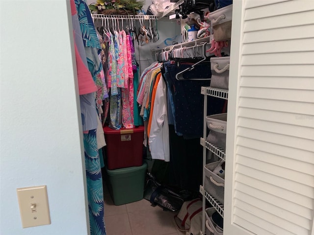 spacious closet featuring tile patterned flooring