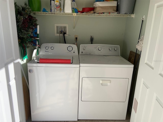 laundry area featuring washing machine and clothes dryer