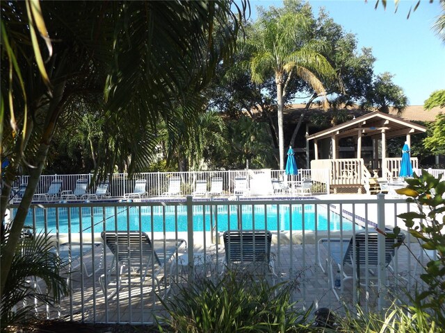 view of swimming pool featuring a patio area