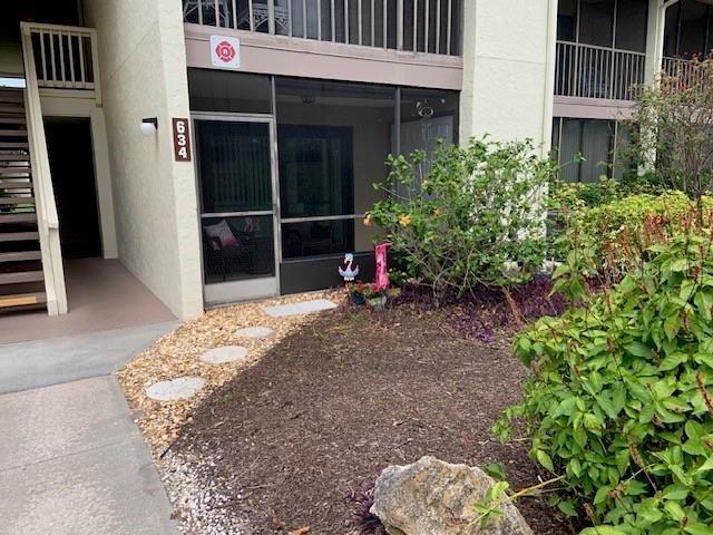 entrance to property featuring stucco siding