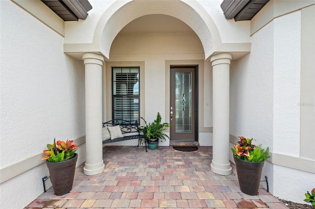 entrance to property with a porch