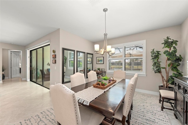 dining space with a chandelier