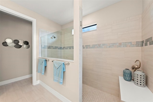 bathroom with tiled shower