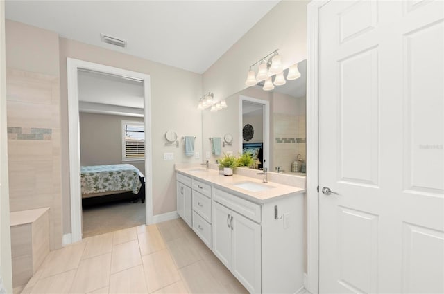 bathroom featuring vanity and tile patterned flooring