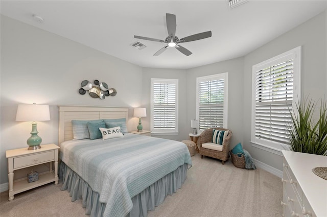 bedroom featuring light carpet and ceiling fan