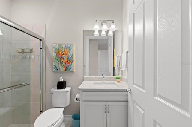 bathroom with vanity, toilet, and an enclosed shower