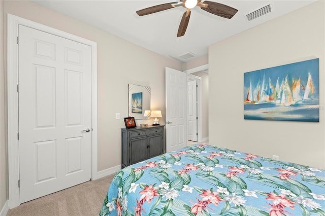 bedroom featuring light colored carpet and ceiling fan