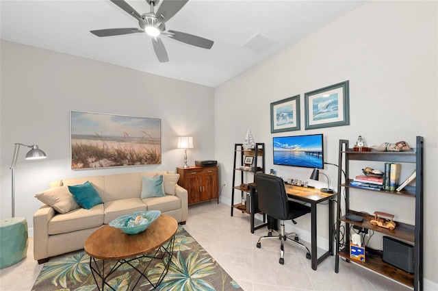 tiled office space featuring ceiling fan