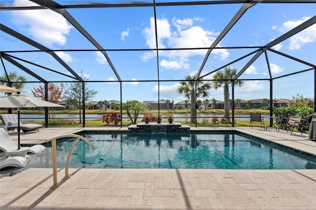 view of swimming pool with pool water feature, a patio, a water view, and glass enclosure