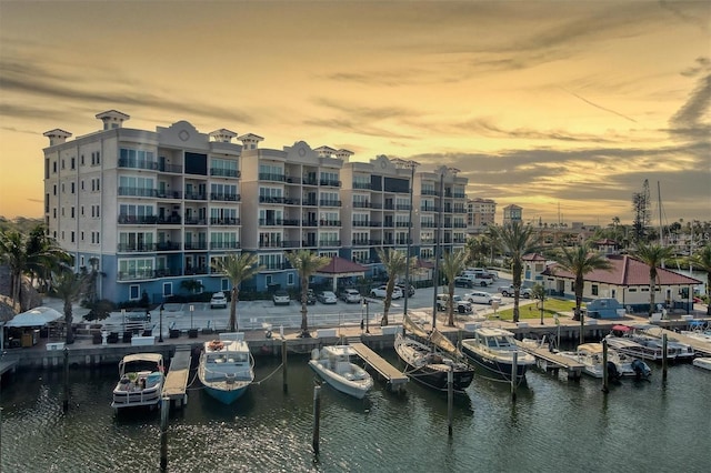 outdoor building at dusk featuring a water view