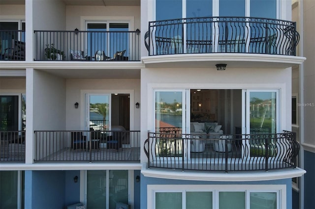 rear view of property featuring a balcony