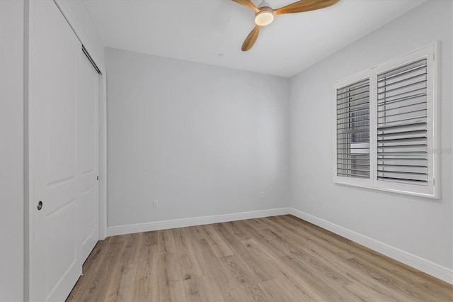 unfurnished bedroom with light hardwood / wood-style flooring, ceiling fan, and a closet